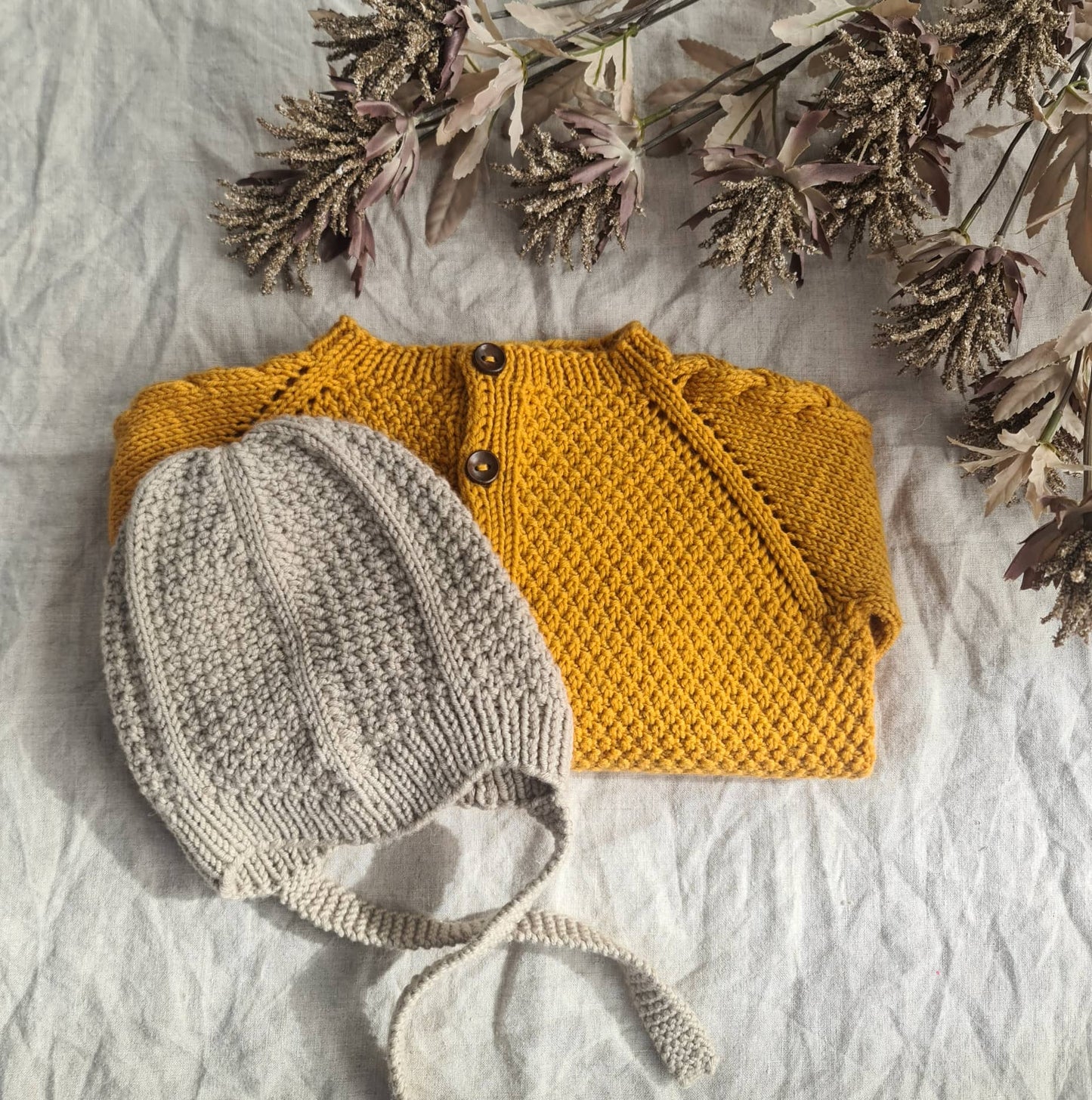 Mouk - Kinderjacke mit Zöpfen und Perlmuster